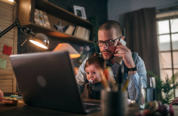 istock father working from home while babysitting his baby girl 1456983553