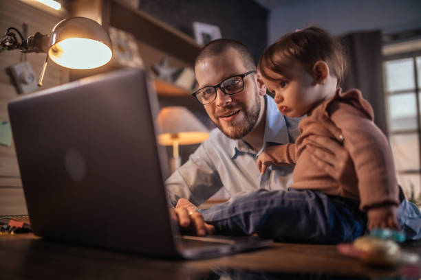 istock father working from home while babysitting his baby girl 1456983601