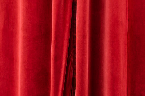 istock The closed red curtain of a stage. 1456986047