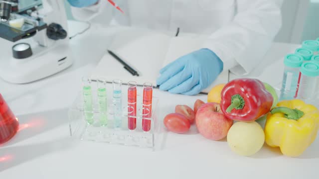 Scientist check chemical food residues in laboratory. Control experts inspect quality of fruits, vegetables. lab, hazards, ROHs, find prohibited substances, contaminate, Microscope, Microbiologist