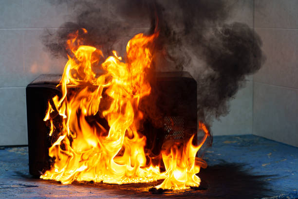 istock microwave oven on fire. the concept of fire in the kitchen. 1456988369