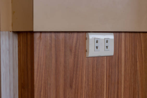 istock plug in power outlet on the wall. 1456990271
