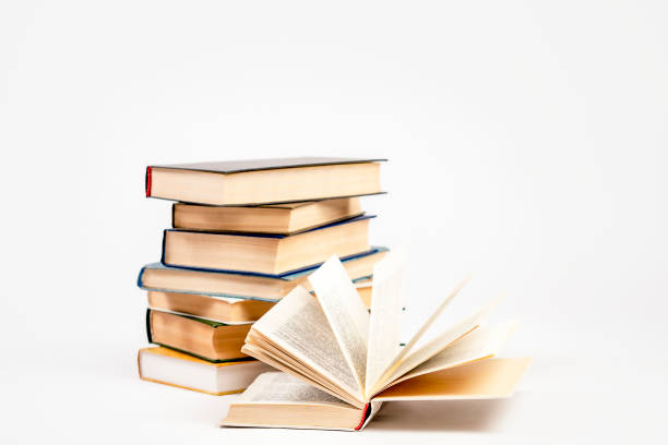 istock A stack of books on a light background. The concept of reading a paper book, learning. 1456992992