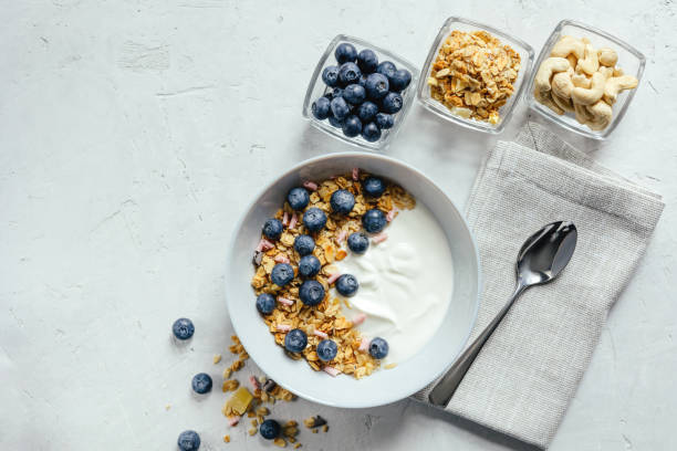istock Yogurt with muesli and berries on a gray background. 1456993044