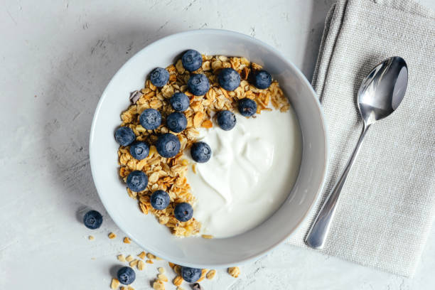 istock Yogurt with muesli and berries on a gray background. 1456993049