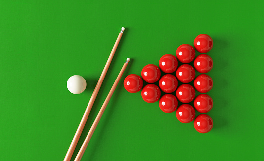 Snooker cue and pool balls over pool table. Directly above. Horizontal composition with copy space. Snooker concept.