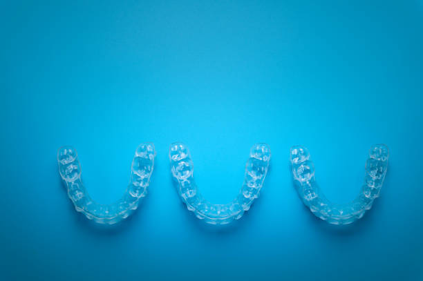istock row of aligners, side view, on a blue background 1456993456