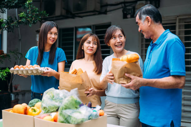 istock Cheerful group of volunteers working together 1456994857