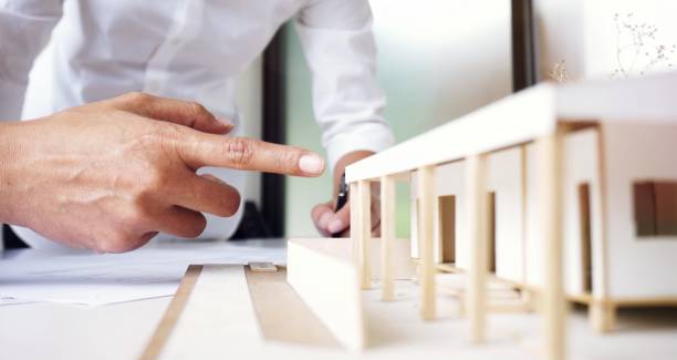 istock Colleagues interior designer Corporate Achievement Planning Design on blueprint Teamwork Concept with compasses 1456996883