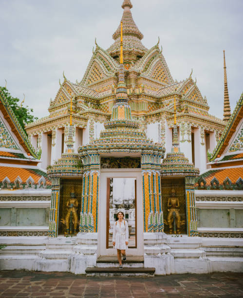 istock Woman exploring  Wat Pho temple in Bangkok 1456997502