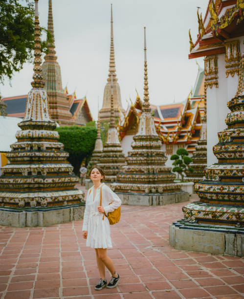 istock Woman exploring  Wat Pho temple in Bangkok 1456997538