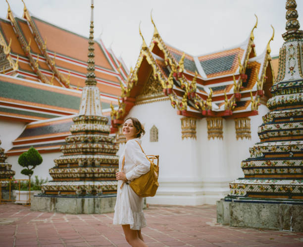 istock Woman exploring  Wat Pho temple in Bangkok 1456997539