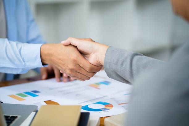 istock Team leader coach teach young workers explain on paper for business plan listen talkative coworker and discussing new project presentation Serious professional advisor consulting in office 1456999568