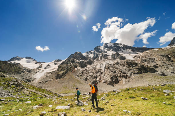 istock Father and son hiking in mountains together 1457000061