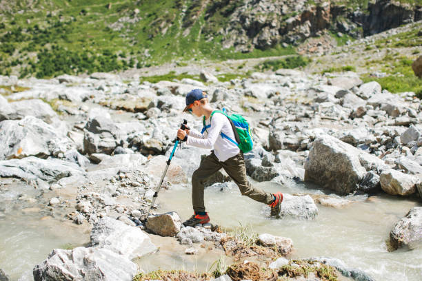 istock Boy hiking in mountains 1457001010