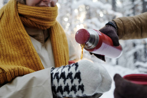 istock Couple drinking hot tea outdoors 1457004728