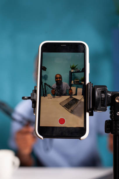 istock Selective focus on live video setup recording happy vlogger after receiving positive feedback talking 1457005254