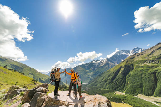 istock Friends hiking in mountains 1457006680