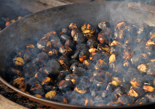Typical for South Tyrol, in the iron pan over the open fire roasted chestnuts (also called 