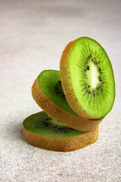 istock Ripe sweet kiwi on concrete background, top view 1457008847