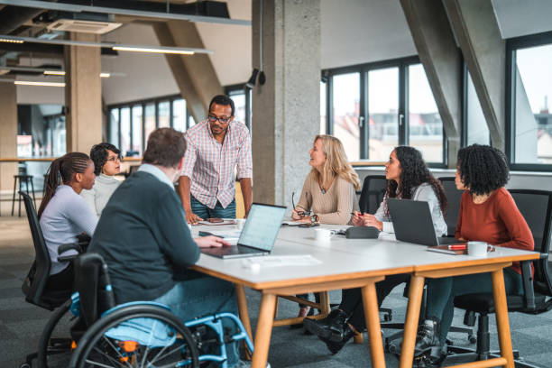 istock Big Group Of Multi Ethnic People and one Disabled Man Having A Work Meeting 1457011341