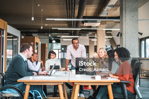 istock Open Concept Office, Where a Work Meeting is Being Held 1457011366