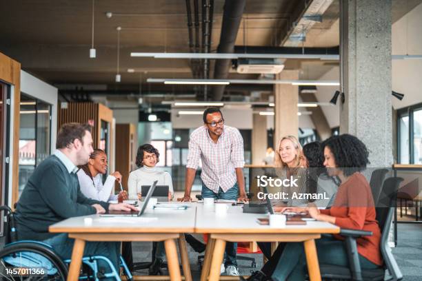 Open Concept Office Where A Work Meeting Is Being Held Stock Photo - Download Image Now