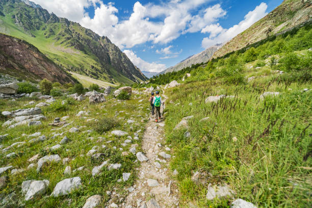 istock Brothers  hiking in mountains 1457011606