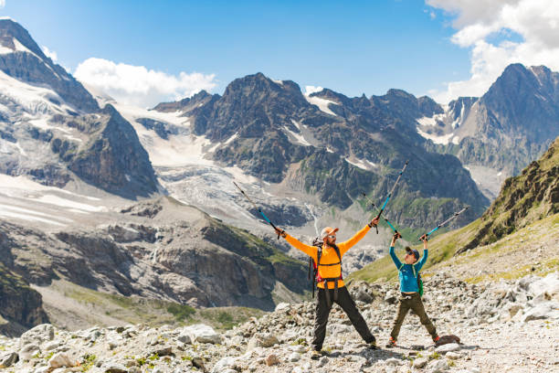 istock Father and son hiking in mountains together 1457011614