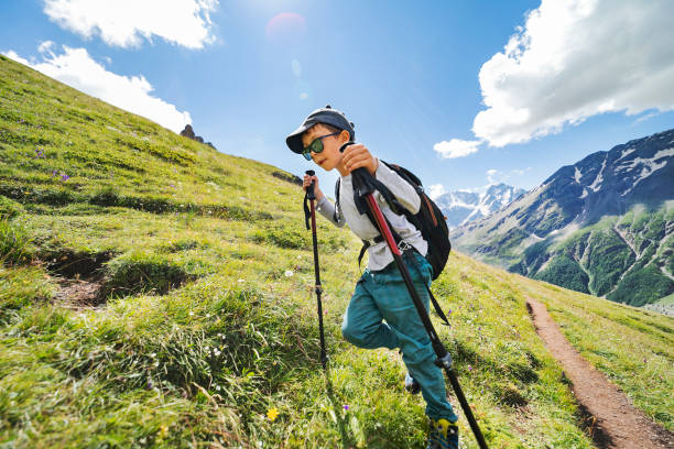 Little boy hiking in mountains