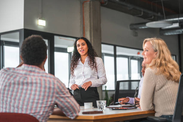 istock Female Manager Answering to Black Colleague 1457012704