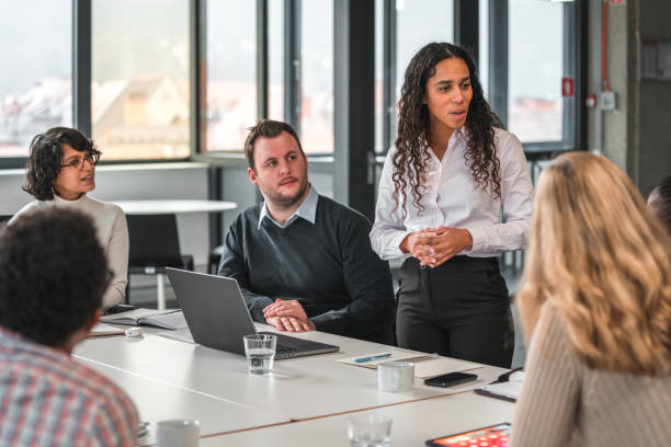istock Enthusiastic Marketing Manager Sharing her Perspective to the Board Members 1457012729