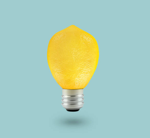 istock Yellow Lemon light bulb on bright blue background. Summer fun concept 1457016721