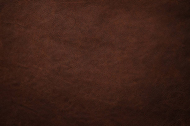 istock natural leather texture background, brown cowhide closeup 1457017017