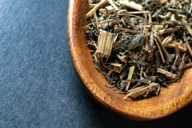 istock chinese medicine sticktight herb on black background 1457021328