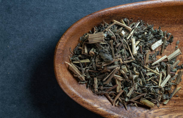 istock chinese medicine sticktight herb on black background 1457021352