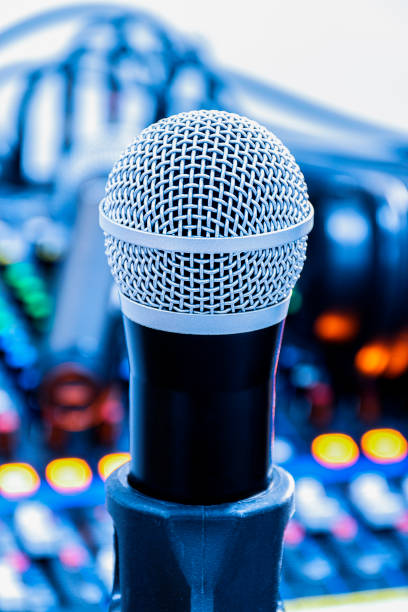istock The microphone on tripod with mixer background in sound control room. 1457023414