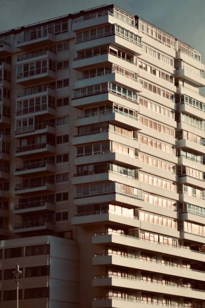 istock White apartment building with focus on windows 1457026528