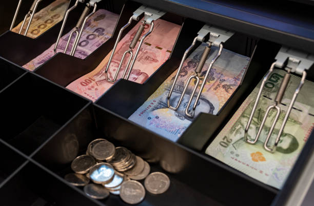 istock Thai bank notes in the cashier machine 1457028176