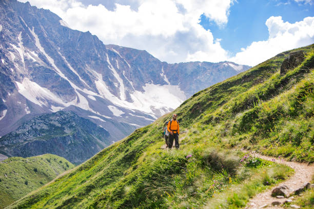 istock Father and son trekking in mountains 1457030303