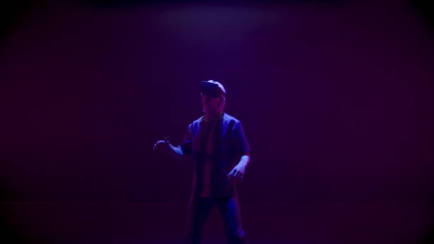 istock Vr player dancing neon lights room. Happy gamer enjoying metaverse simulation in 1457031765