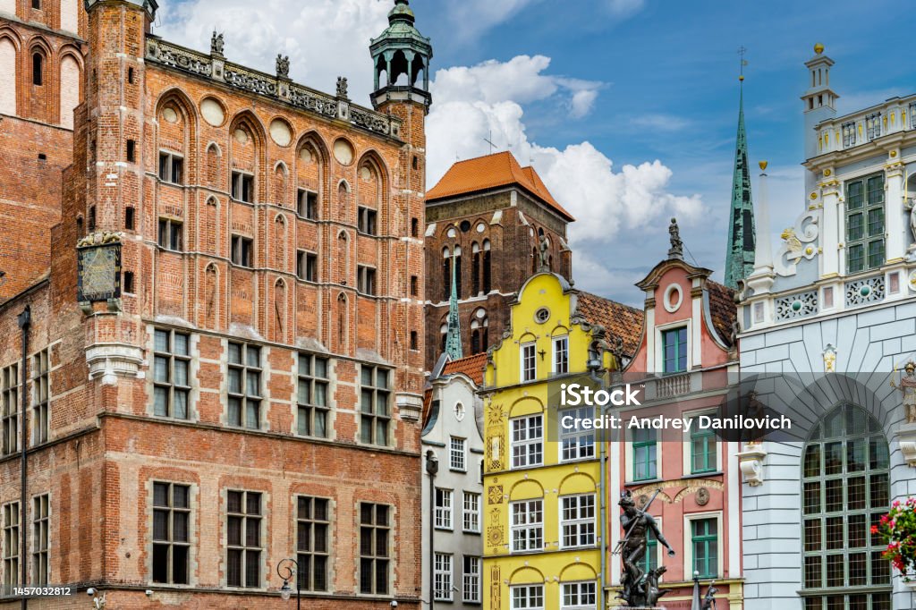 Colorful facades of old buildings in the centre of Gdansk old town. Old buildings facades in old town of Gdansk (Srodmiescie historic district). Blue sky is on the background. Architecture Stock Photo