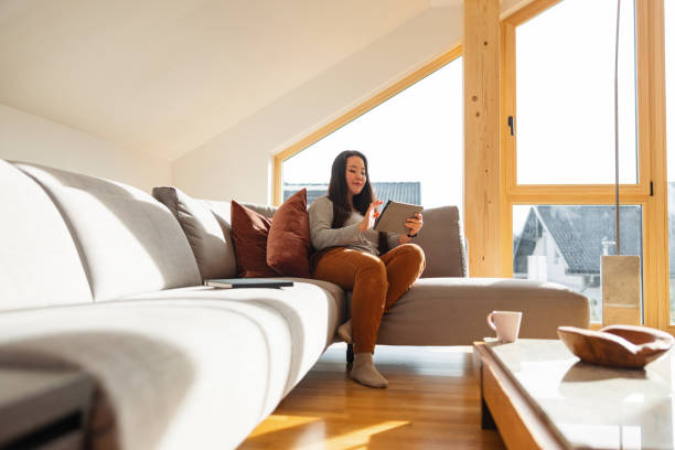 istock Young Asian Female Banking On The Smart Tablet 1457034381