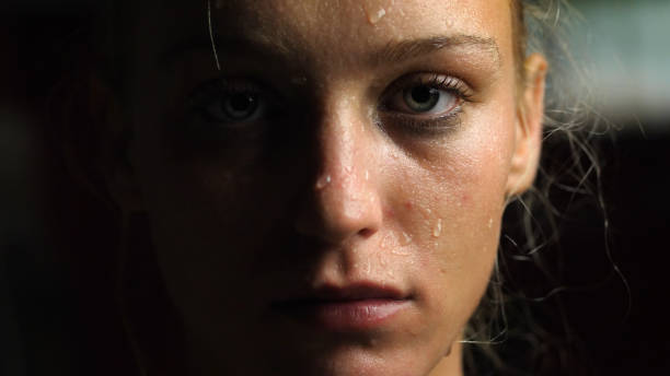 Sweaty Woman Looking at the Camera, Close-up Sweaty Woman Looking at the Camera, Close-up Shot sweat stock pictures, royalty-free photos & images