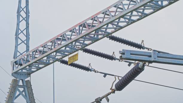 istock High Voltage Electric Power Grid Poles with Ceramic Insulators at Transformer Substation 1457035696