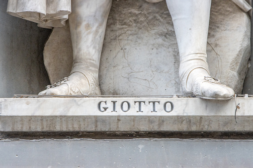 Giovanni Dupré (1817-1882) was the Italian sculptor of this statue of Giotto Di Bondone in the open public space known as the Niches of the Uffizi Colonnade in Florence, Italy, in 1845. Giotto is famous for completing Giotto’s Bell Tower, better known as the Florence Campanile.