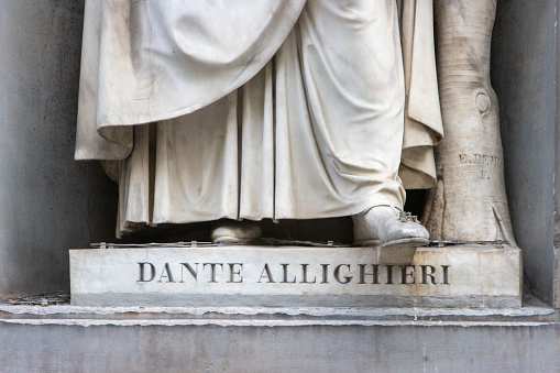 Dante Alighieri (1265-1321) in the Niches of the Uffizi Colonnade in Florence, Italy. His sculpture is located in an open public space in the Niches.