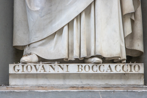 Giovanni Boccaccio (1313-1375) in the Niches of the Uffizi Colonnade in Florence, Italy. An Italian scribe, poet, correspondent of Petrarch, and a humanist during the Renaissance.  The sculpture is located in the open public space known as the Uffizi Niches.