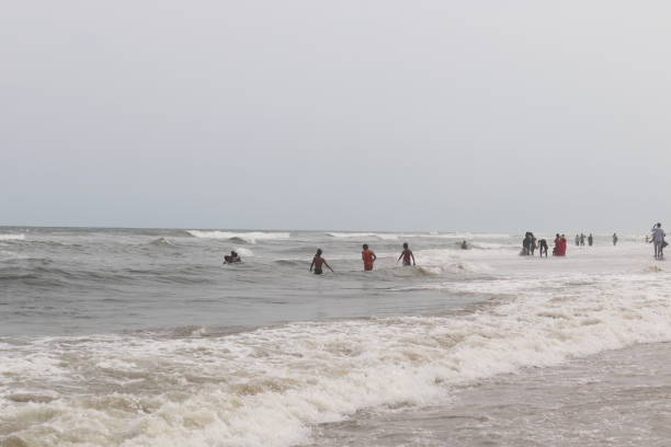 istock Children are bathing at the Indian sea's waves. 1457037404
