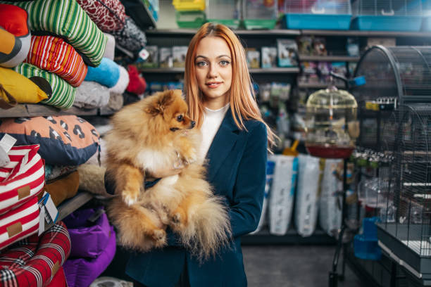 istock Woman in pet shop 1457039058